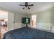 Large bedroom with a queen bed, en-suite bathroom and carpet at 303 Walnutwood Trl, Roswell, GA 30075