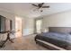 Spacious bedroom with a queen bed, en-suite bathroom and carpet at 303 Walnutwood Trl, Roswell, GA 30075