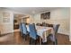 Formal dining room with hardwood floors and a large table at 303 Walnutwood Trl, Roswell, GA 30075