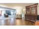 Living room with hardwood floors, fireplace, and antique cabinet at 303 Walnutwood Trl, Roswell, GA 30075