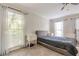 Bright bedroom with a queen bed, large windows and carpet at 303 Walnutwood Trl, Roswell, GA 30075