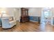 Bright living room with hardwood floors and antique cabinet at 303 Walnutwood Trl, Roswell, GA 30075