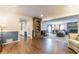 Open living room with hardwood floors and a view into the kitchen and dining room at 303 Walnutwood Trl, Roswell, GA 30075
