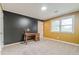 Bedroom with two-tone painted walls, carpeted floors, and built-in desk at 303 Walnutwood Trl, Roswell, GA 30075