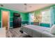 Spacious bedroom featuring teal walls, wood floors, and ample closet space at 303 Walnutwood Trl, Roswell, GA 30075
