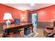 Home office with a large desk, leather chairs, and hardwood floors at 303 Walnutwood Trl, Roswell, GA 30075