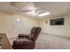 Spacious basement rec room with large TV and comfortable seating at 303 Walnutwood Trl, Roswell, GA 30075