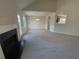 Spacious living room features a fireplace and vaulted ceiling at 50 Ivans Cir, Covington, GA 30016