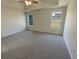 Empty main bedroom with carpet and ceiling fan at 50 Ivans Cir, Covington, GA 30016