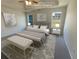 Virtually staged main bedroom with a king bed and bench at 50 Ivans Cir, Covington, GA 30016