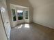 Spacious bedroom with large bay window and carpet flooring at 50 Ivans Cir, Covington, GA 30016