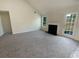 Living room with fireplace and backyard access at 50 Ivans Cir, Covington, GA 30016