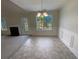 Bright dining room with hardwood floors and access to backyard at 50 Ivans Cir, Covington, GA 30016
