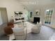 Virtually staged living room with fireplace and access to backyard at 50 Ivans Cir, Covington, GA 30016