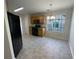 Kitchen with wood cabinets and tile floors at 50 Ivans Cir, Covington, GA 30016