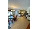 Kitchen and dining area with tile floors and wood table at 3060 Habersham Cir, Covington, GA 30014