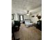 Bright bedroom with a queen-size bed and gaming setup at 3060 Habersham Cir, Covington, GA 30014