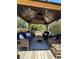 Covered patio gazebo with wicker furniture and ceiling fan at 3060 Habersham Cir, Covington, GA 30014