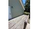 Wooden deck overlooks grassy yard; features white door and exterior wall at 3060 Habersham Cir, Covington, GA 30014