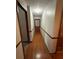 Long hallway with hardwood floors and neutral walls at 3060 Habersham Cir, Covington, GA 30014
