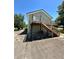Home with deck and stairs leading to a lower level at 3060 Habersham Cir, Covington, GA 30014