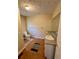 Small bathroom includes toilet, sink, and grey countertop at 3060 Habersham Cir, Covington, GA 30014