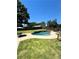 Inviting kidney shaped pool with stone coping and surrounding lawn at 3060 Habersham Cir, Covington, GA 30014