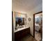 Main bathroom with double vanity and access to additional bathroom at 3060 Habersham Cir, Covington, GA 30014