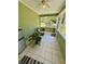 Relaxing screened porch with tile flooring and ceiling fan at 3060 Habersham Cir, Covington, GA 30014