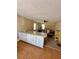 Kitchen features white cabinets and a pass-through to adjoining room at 3060 Habersham Cir, Covington, GA 30014