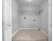 Laundry room with shelving and tile floor at 89 Elsberry Rd, Dallas, GA 30157