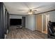 Living Room with large TV and dark wood floors at 50 White Birch Dr, Covington, GA 30016