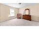 Bright bedroom with dresser and comfortable armchair at 3037 Nicholas Dr, Villa Rica, GA 30180