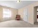 Well-lit bedroom with an adjoining door at 3037 Nicholas Dr, Villa Rica, GA 30180