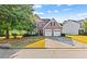 Two-story house with a large front yard and two-car garage at 3037 Nicholas Dr, Villa Rica, GA 30180