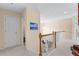 Upstairs hallway with neutral decor and access to bedrooms at 3037 Nicholas Dr, Villa Rica, GA 30180