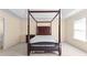 Main bedroom with four-poster bed and carpeting at 3037 Nicholas Dr, Villa Rica, GA 30180