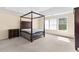 Main bedroom with a four-poster bed and ample space at 3037 Nicholas Dr, Villa Rica, GA 30180