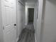 Clean hallway with gray vinyl flooring and white doors at 257 E Simon Nw Ter, Atlanta, GA 30318