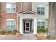 Inviting building exterior with brick and siding, featuring a covered entryway at 1965 Nocturne Dr # 1209, Alpharetta, GA 30009