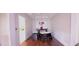 Dining area with hardwood floors and a charming chandelier at 5179 Meadowbrooke Chase, Stone Mountain, GA 30088