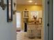 Kitchen with island and white cabinets at 5179 Meadowbrooke Chase, Stone Mountain, GA 30088