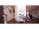 Bright entryway with hardwood floors and mirrored cabinet at 5179 Meadowbrooke Chase, Stone Mountain, GA 30088