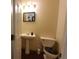 Clean and updated half bathroom with pedestal sink and toilet at 5179 Meadowbrooke Chase, Stone Mountain, GA 30088