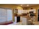 Kitchen with granite island, stainless steel appliances, and access to patio at 5179 Meadowbrooke Chase, Stone Mountain, GA 30088