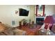 Living room features hardwood floors and a cozy fireplace at 5179 Meadowbrooke Chase, Stone Mountain, GA 30088