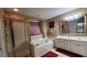 Bathroom with double vanity, soaking tub, and shower at 5179 Meadowbrooke Chase, Stone Mountain, GA 30088