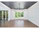 Bright dining room with hardwood floors, large windows and a statement chandelier at 3850 Creekview Ne Dr, Marietta, GA 30068