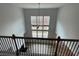 Second floor overlook of the main living area with high ceilings at 255 Arwen Dr, Mcdonough, GA 30252
