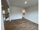 Bright dining room with hardwood floors and kitchen access at 255 Arwen Dr, Mcdonough, GA 30252